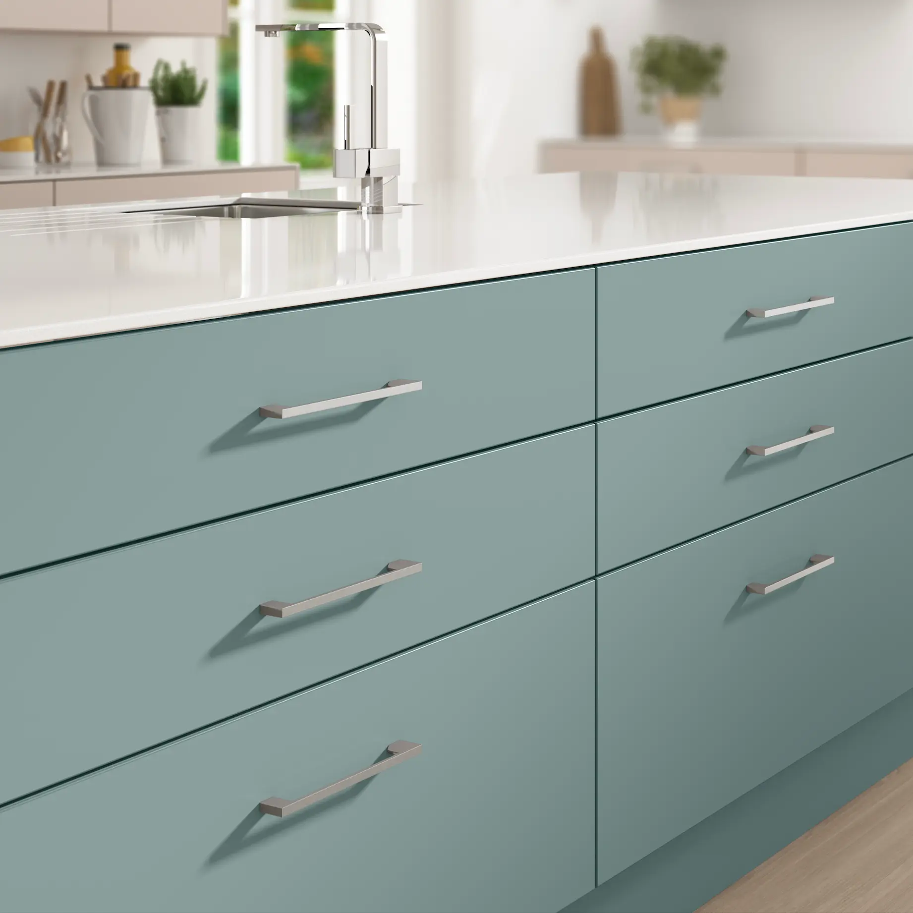 Contemporary teal kitchen island with a white quartz worktop, part of a new fitted kitchen from Maintain Home Solutions